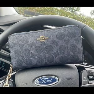 Coach wristlet with wrist strap